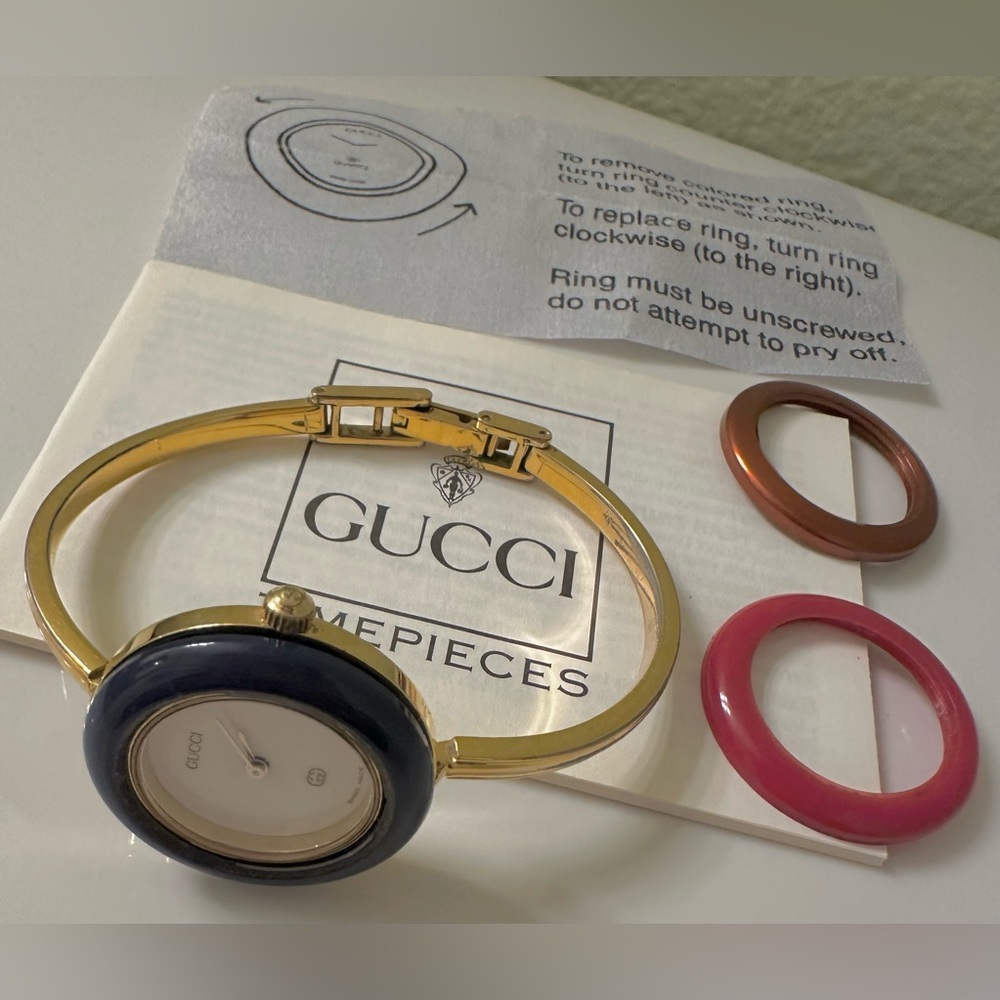 Gucci Gold Bangle Watch with Interchangeable Black, Red, and Brown/Chrome Bezels